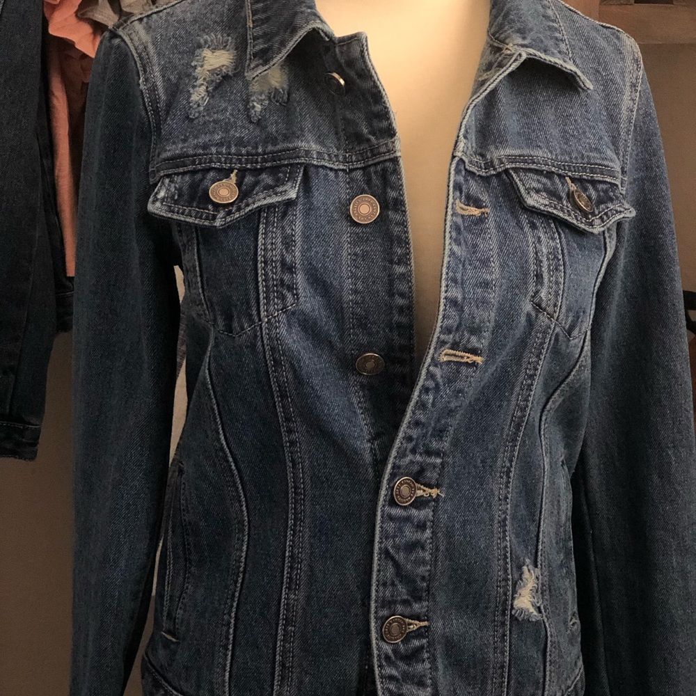 Trademark distressed denim jacket